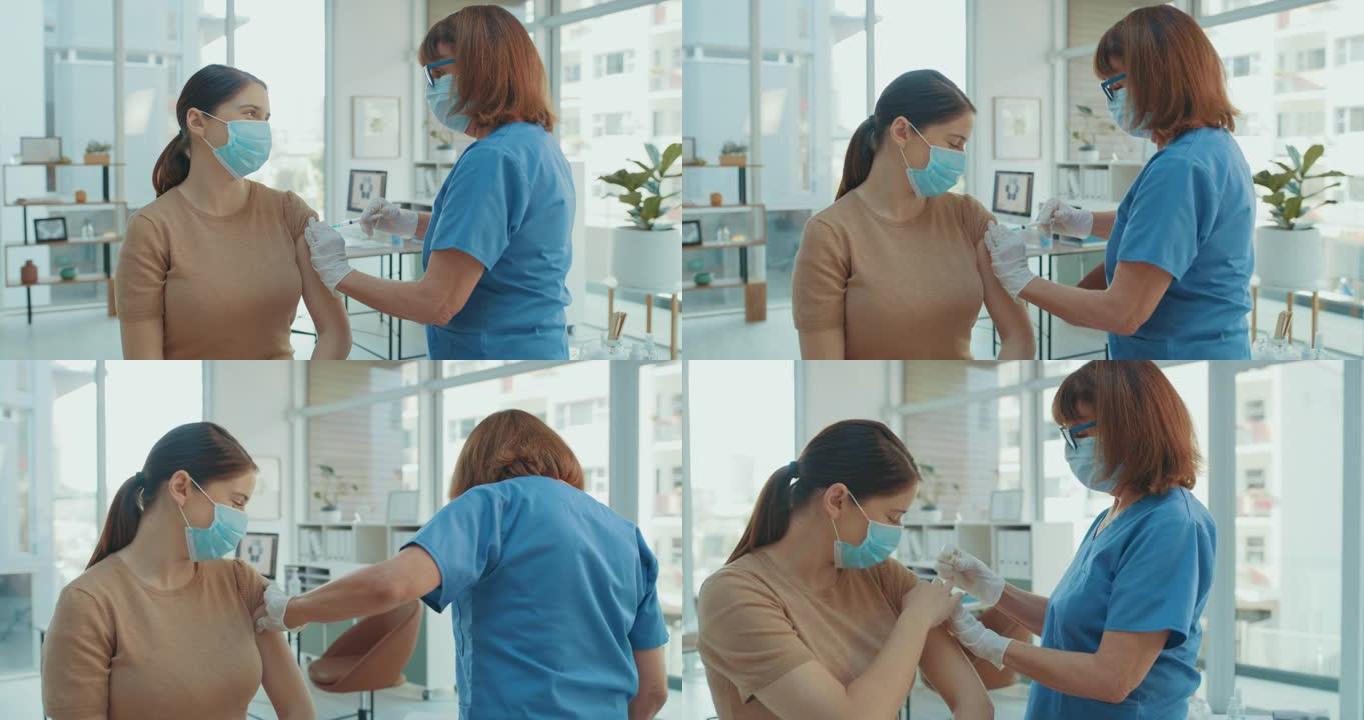 4k视频片段，一名护士戴着口罩并在诊所给患者接种Covid疫苗