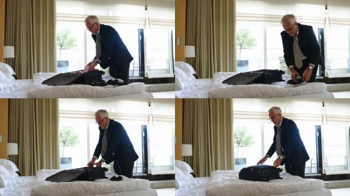 商人在酒店房间打包行李