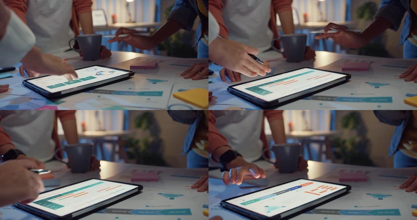 特写亚洲商人会议计划分析统计集思广益和团队标题持有平板电脑点图表，员工在家庭办公室晚上注意。