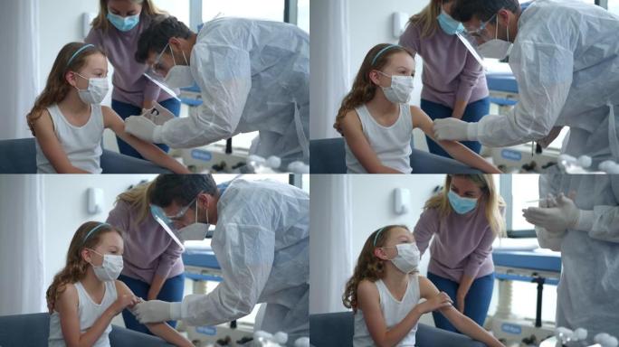 拉丁美洲女孩和妈妈在医院接种新型冠状病毒肺炎疫苗
