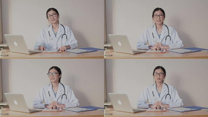 亚洲女医生通过视频聊天在线咨询患者，远程医疗和远程医疗概念
