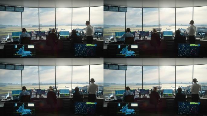 多元化的空中交通管制团队在现代化的机场塔中工作。办公室里满是台式电脑显示屏，配有导航屏幕，飞机飞行雷