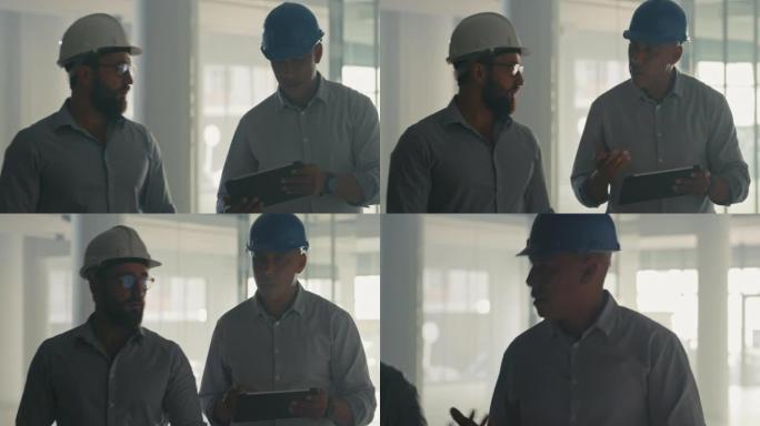 两名建筑师或工程师同事在进行团队建设项目时使用数字平板电脑。男人在网上看建筑计划的蓝图