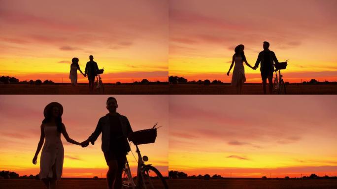 一对成年夫妇牵着手，走向相机并骑自行车的轮廓的静态慢动作镜头