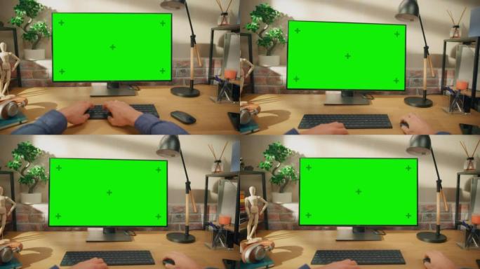 在具有绿屏模拟显示的台式计算机上工作的人的POV第一人称视图。男性坐在办公桌前，在时尚的客厅在家中打