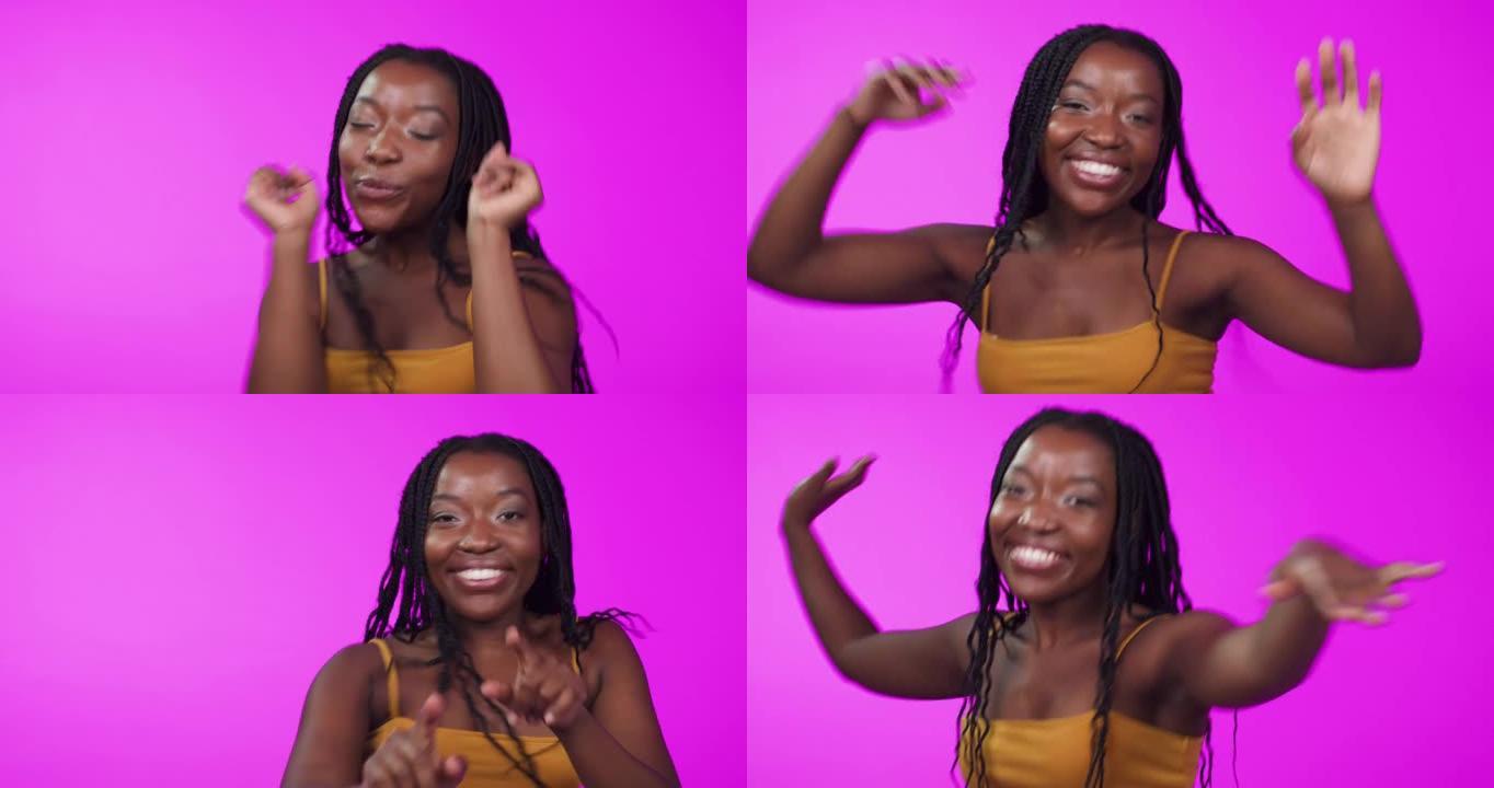 4k视频片段，一名年轻女子在粉红色背景下跳舞