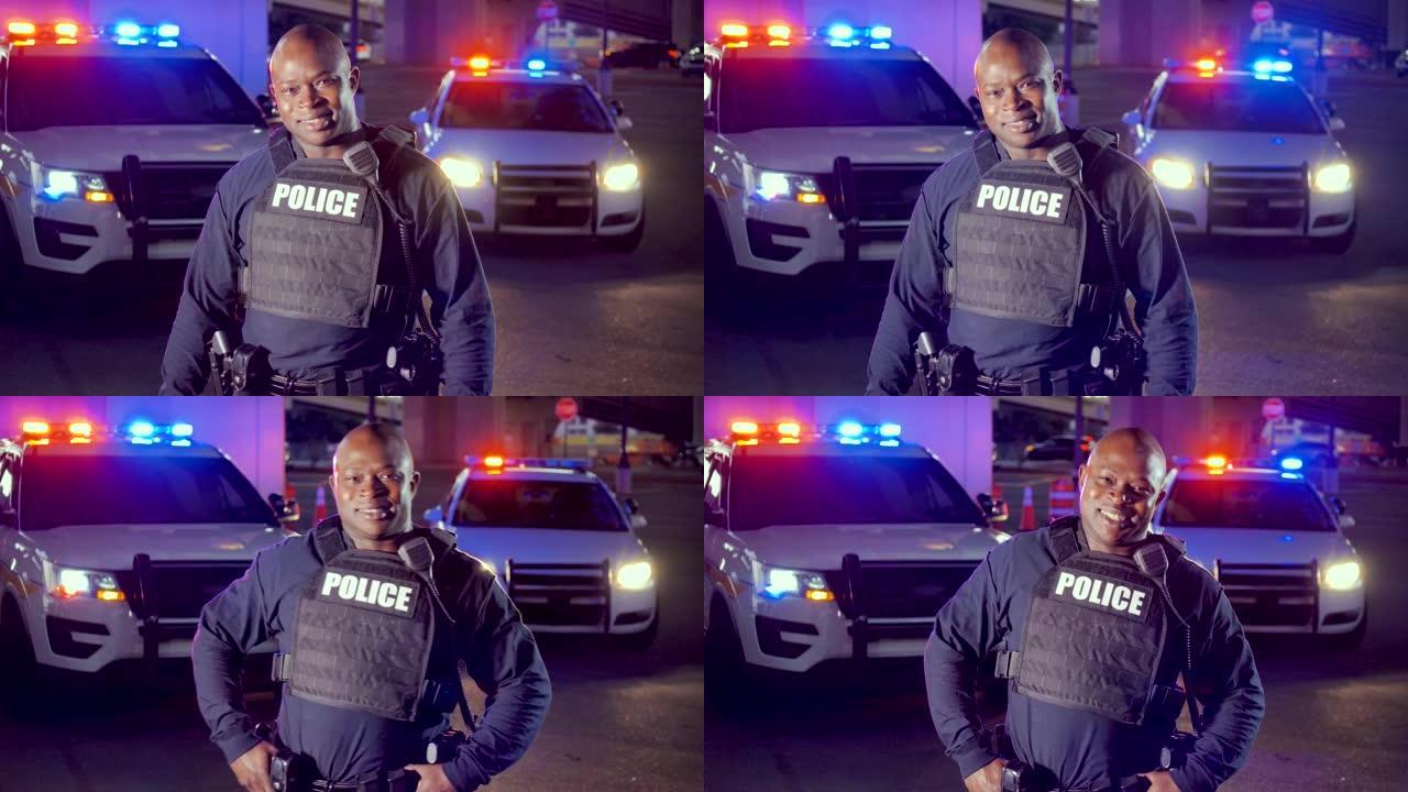 夜间有巡逻车的非裔美国警察