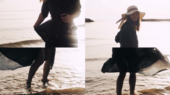 惊人的镜头耀斑肖像年轻美丽的黑发女人与相机在史诗般的日出海滩慢动作摆姿势。