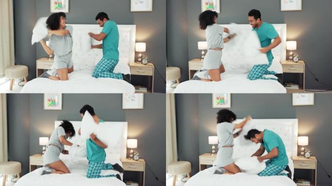 幸福的夫妻，爱情和枕头在早上在卧室，房子或家里的床上打架。兴奋，喜剧和顽皮，浪漫的男人和女人玩垫子，
