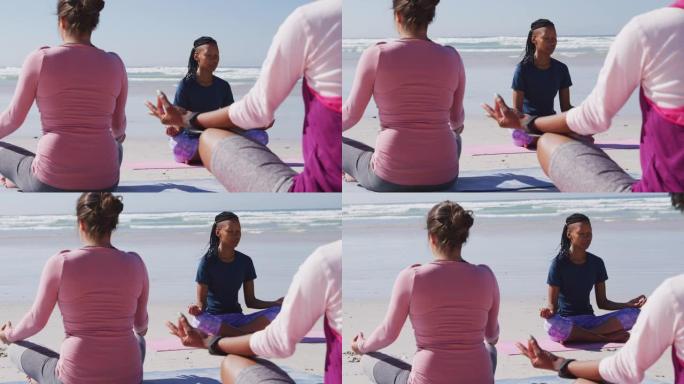在沙滩和蓝天背景上做瑜伽的多民族妇女