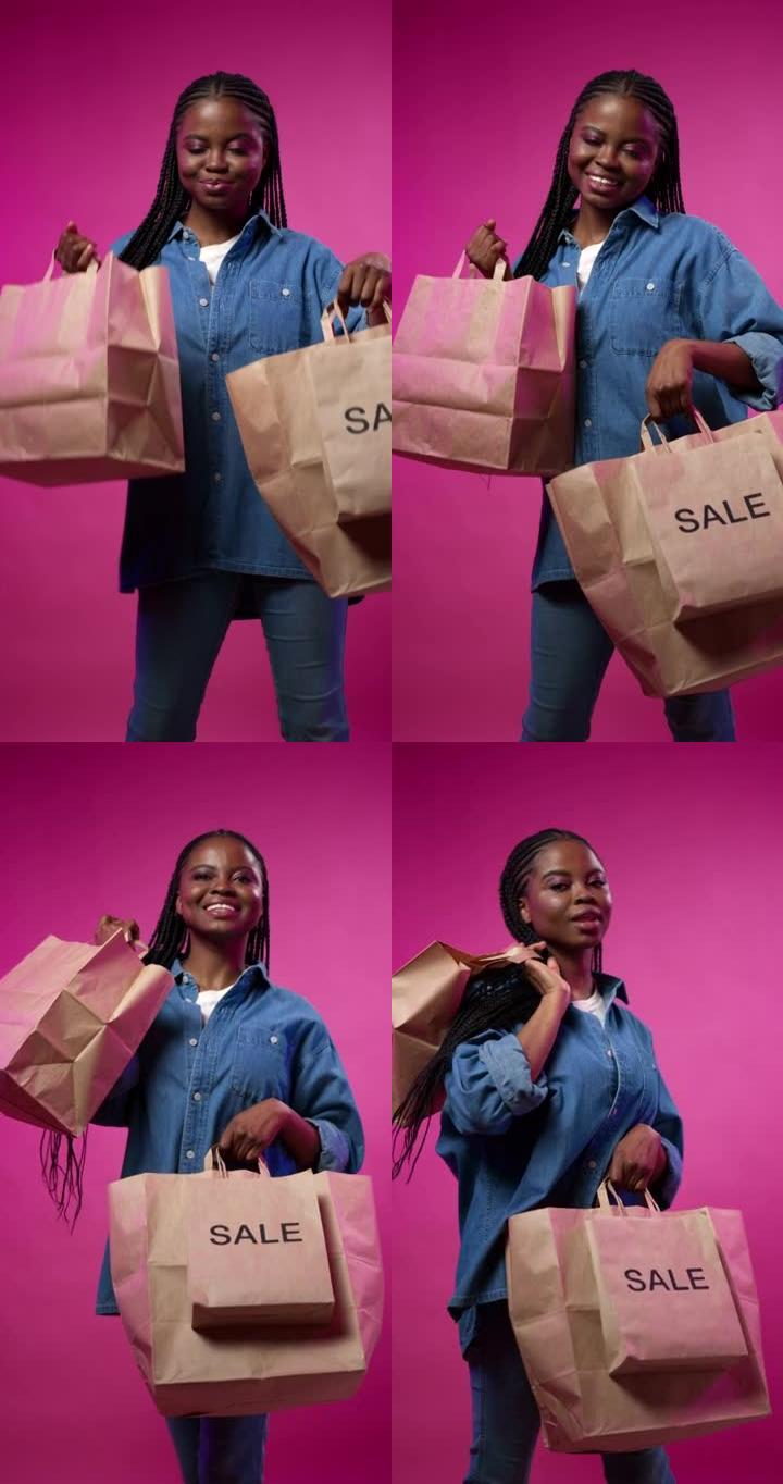 一位年轻的黑皮肤博客作者展示了她的纸质购物袋，享受着成功且有利可图的购买
