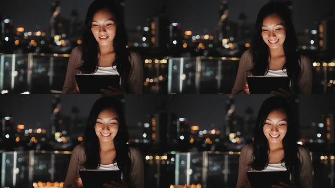 亚洲女性晚上使用智能手机