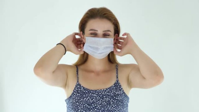 年轻的成年妇女戴着污染面具，以保护自己免受病毒侵害。4k视频