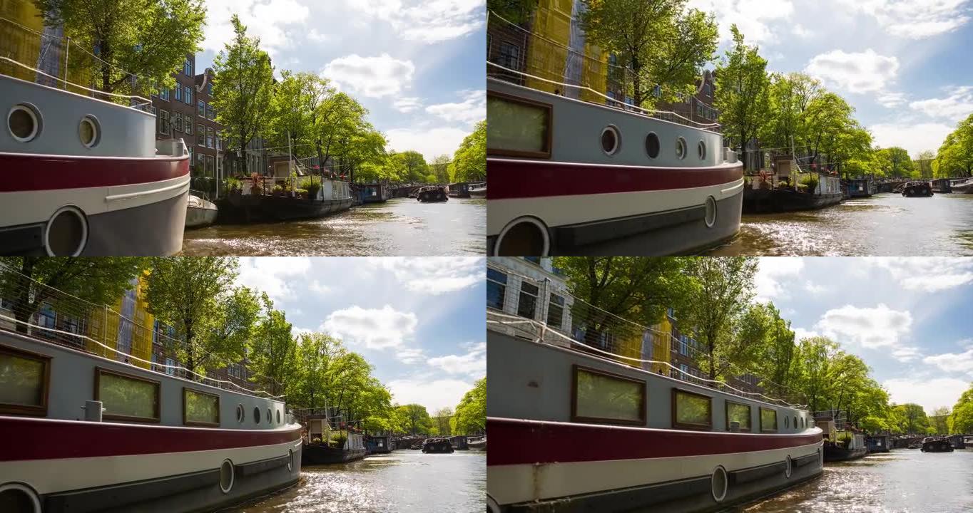 从船上看到的田园诗般的阿姆斯特丹城市景观，沿着运河巡游
