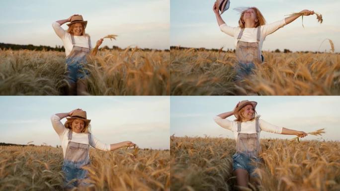 无忧无虑的女人在田间奔跑时拿着小麦和草帽