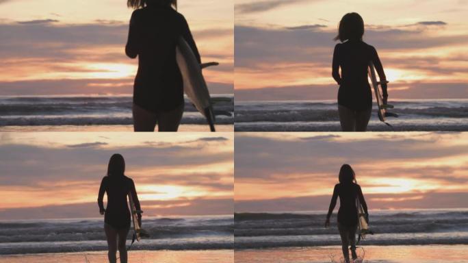 日落时在热带海滩上与冲浪板一起跑步的冲浪女孩的剪影。