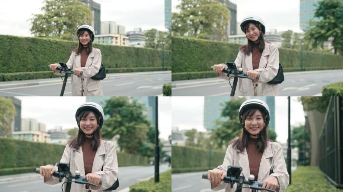 亚洲女商人乘坐踏板车出差的肖像。