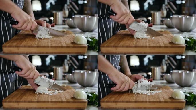 特写厨师用手在砧板上用刀将白洋葱切成薄片。木板上的新鲜蔬菜。厨师在家准备食物。沙拉传统厨房4k的健康