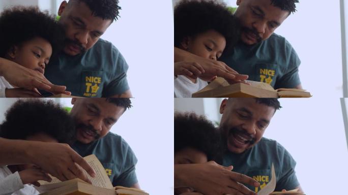 婴儿倾斜父亲陪伴阅读书籍耐心