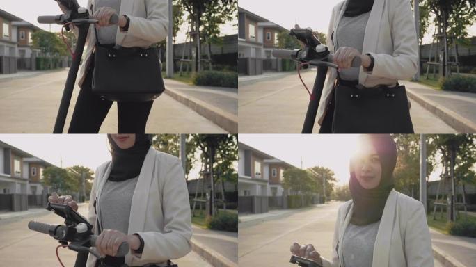 穆斯林妇女使用手机通过app解锁电动踏板车