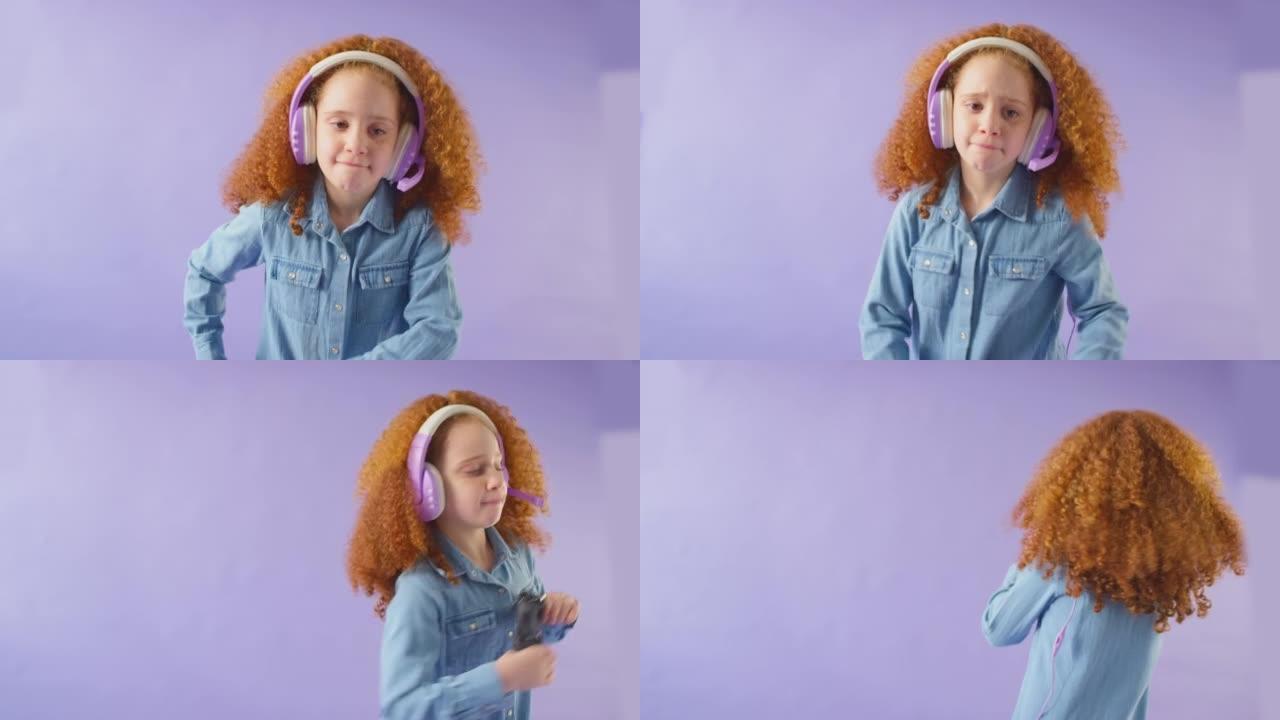 红头发女孩戴着游戏耳机的工作室镜头，背景为控制器-慢动作拍摄