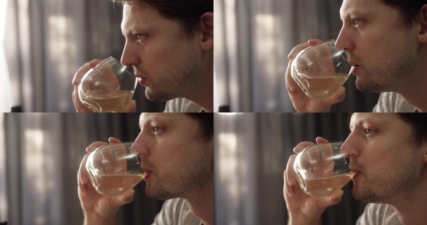 一名男子吃喝一杯酒的4k录像