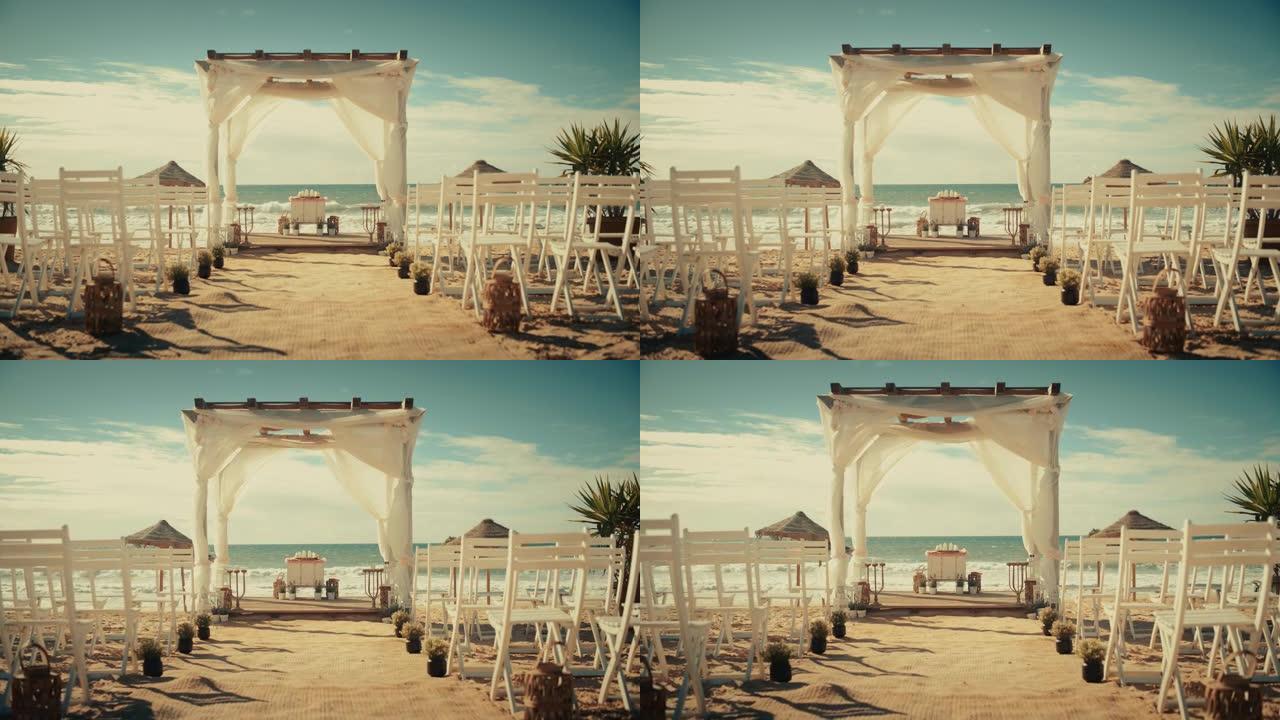 空荡荡的户外婚礼场地，配有椅子，可在靠近大海或海洋的海滩上举行正式仪式。一切都为美丽浪漫的婚姻庆典做