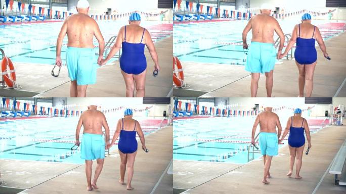 老年夫妇手牵手走在室内泳池甲板上