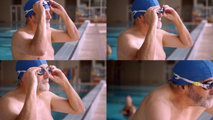 高级男子在室内游泳池游泳时戴护目镜