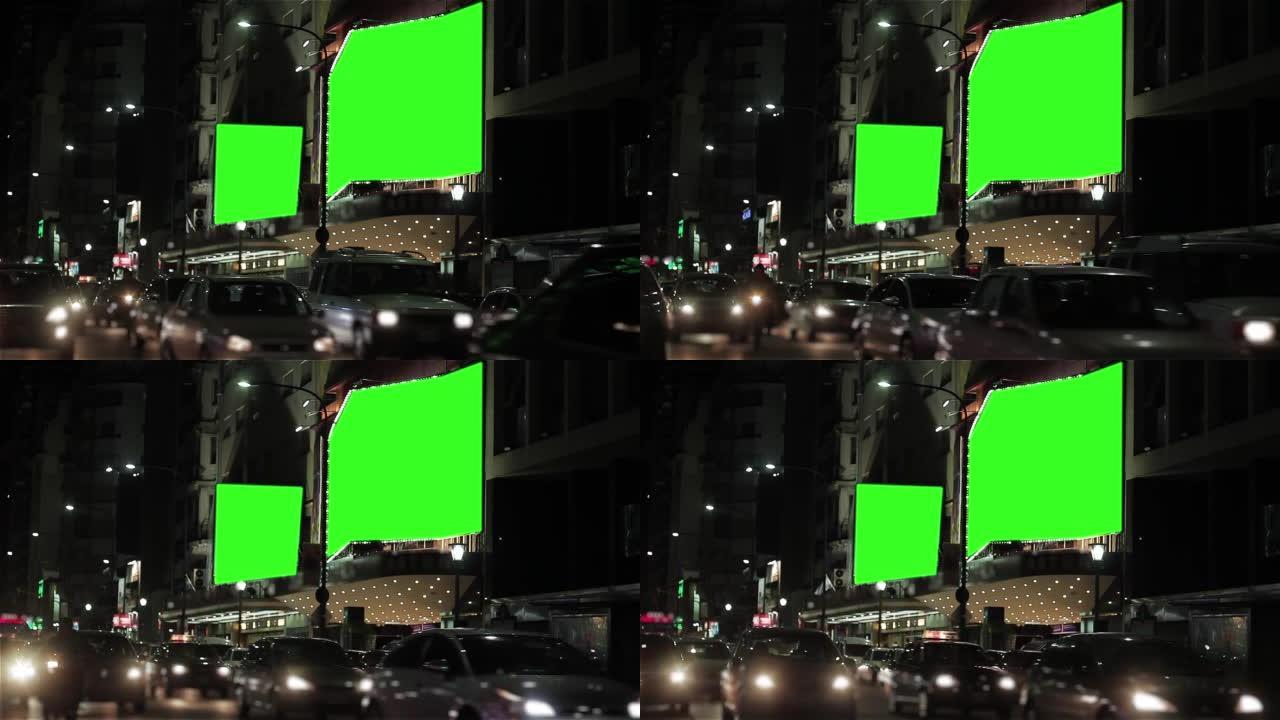 大型选框，带有绿色色度键背景，晚上在剧院或电影院的入口处有灯泡。4k分辨率。
