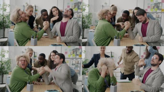 有趣的家伙同事在工作场所摔跤比赛下班后放松