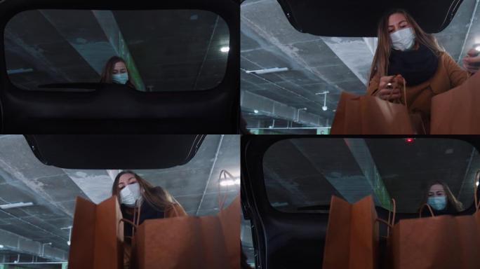 在车内，戴着口罩的30多岁年轻金发女子打开靴子，将购物袋放在停车场内，关上门。