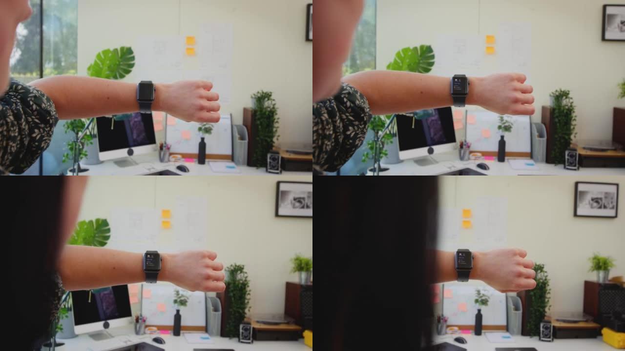 办公室工作人员在办公桌前看着智能手表的POV镜头-慢动作镜头