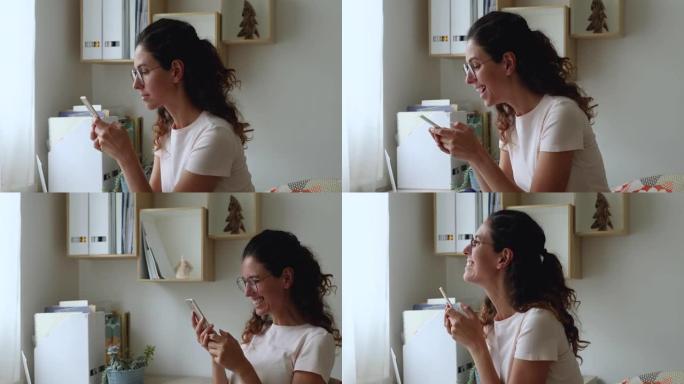 女人拿着手机看短信说加薪感觉幸福