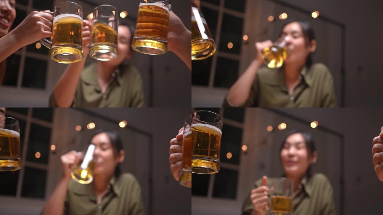 亚洲朋友正在庆祝他们碰杯啤酒的节日