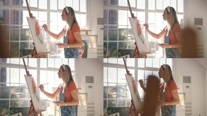 年轻艺术家在艺术工作室的画布上练习绘画技巧。女人通过艺术放松和表达自己，这是周末享受的积极爱好。使用