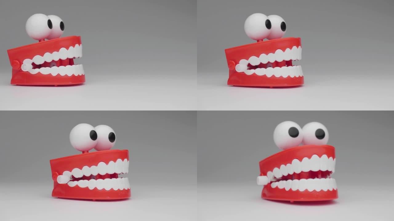 在白色背景上移动的牙齿玩具。
