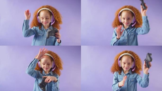 红头发女孩戴着游戏耳机的工作室镜头，背景为控制器-慢动作拍摄