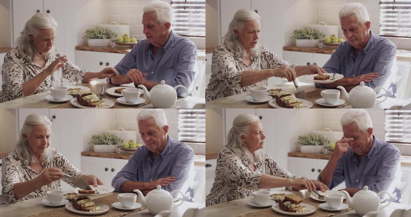 一对高级夫妇在家喝茶和蛋糕的4k视频片段