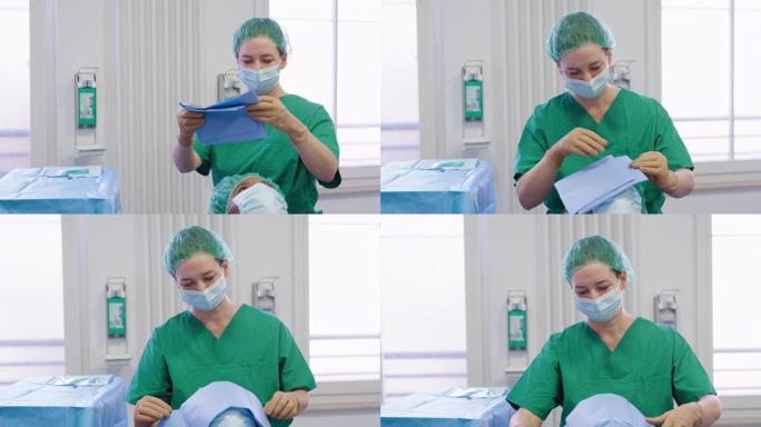 眼科医生在手术前在女性患者脸上披上手术窗帘