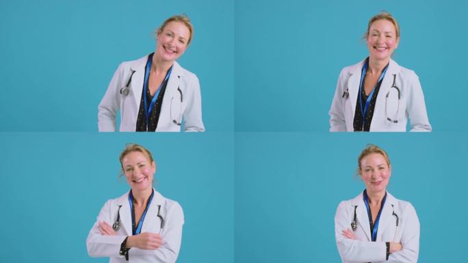 微笑的女医生穿着白色外套站在蓝色工作室背景前的肖像