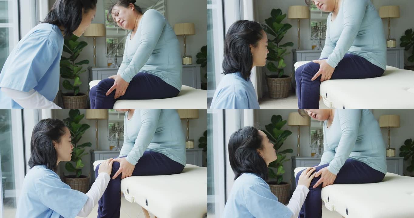 亚洲女性理疗师检查女性患者在手术中膝盖疼痛