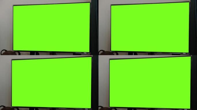 带绿色色度键屏幕的发光二极管屏幕电视。放大。