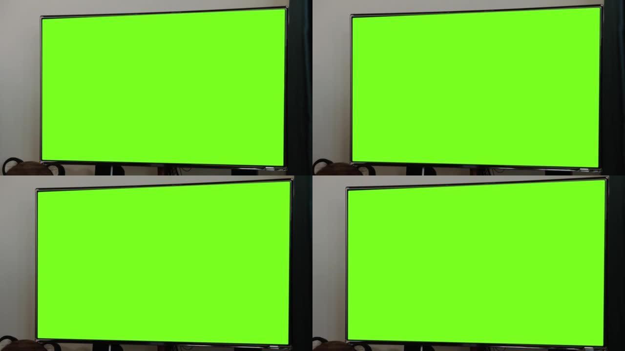 带绿色色度键屏幕的发光二极管屏幕电视。放大。