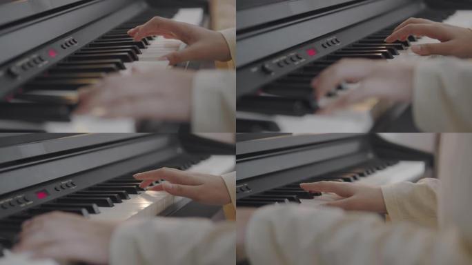 特写亚洲少年手在家里的客厅弹奏键盘钢琴。美丽的女孩钢琴家在社交媒体上直播时弹钢琴。网络影响者Vlog