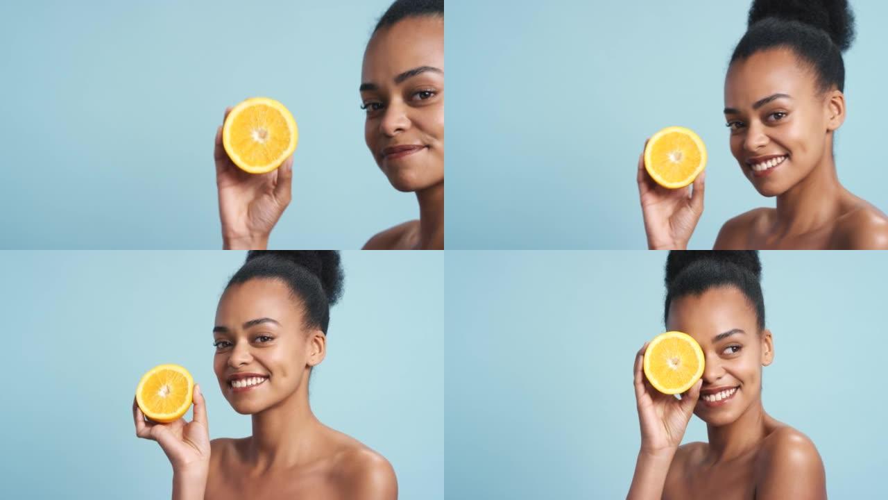 柠檬，黑人女性护肤和面部皮肤，水果健康，蓝色工作室背景下的健康。快乐的肖像，微笑或美容模型，手里拿着