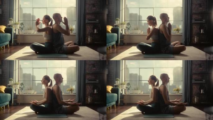 年轻美丽的夫妇锻炼身体，早上在阳光明媚的阁楼公寓练习冥想。健康的生活方式、健身、幸福和正念概念。