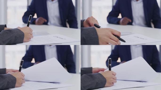 4k视频片段，一名无法辨认的女商人在她的办公室签署文书工作