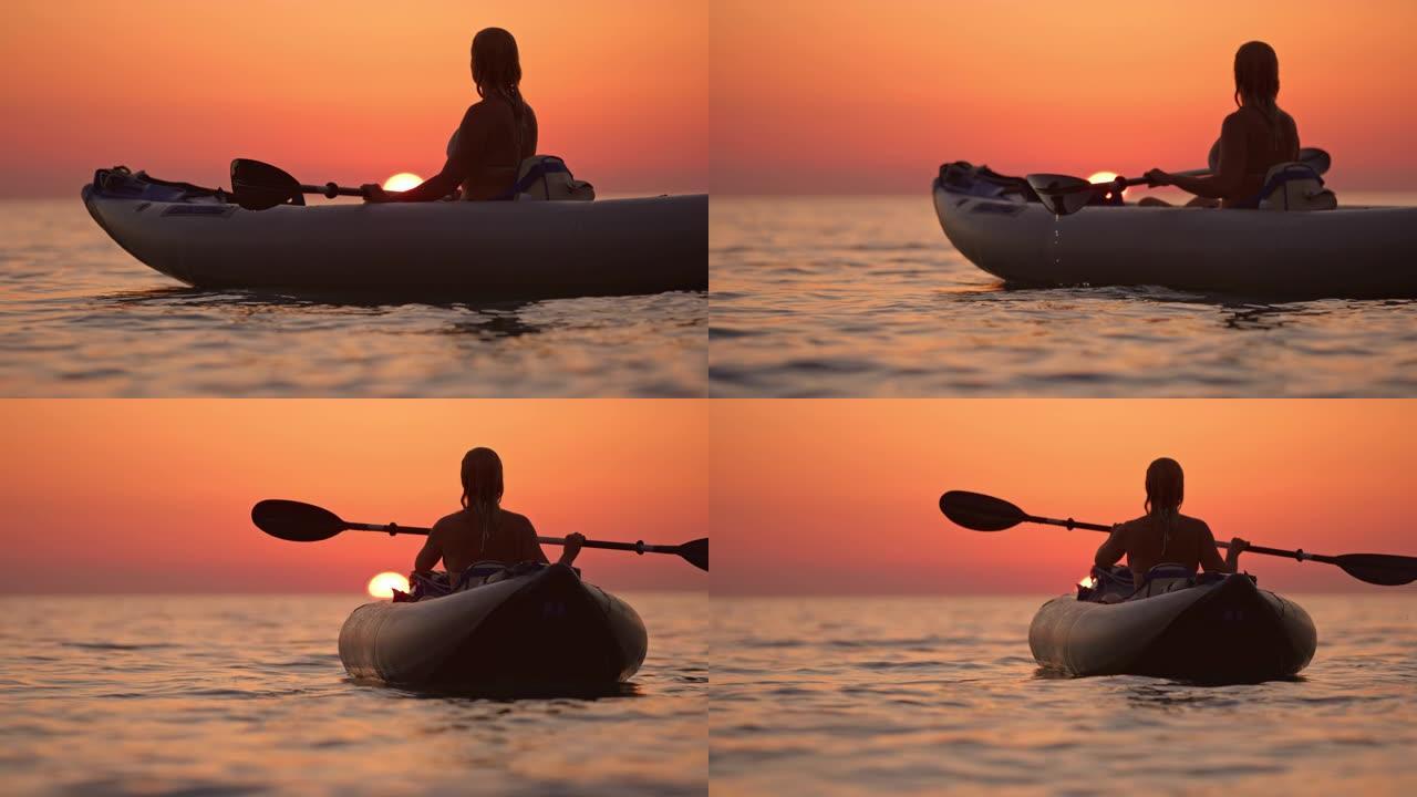 女士剪影年轻女子在划艇上享受宁静的日落，亚得里亚海，克罗地亚