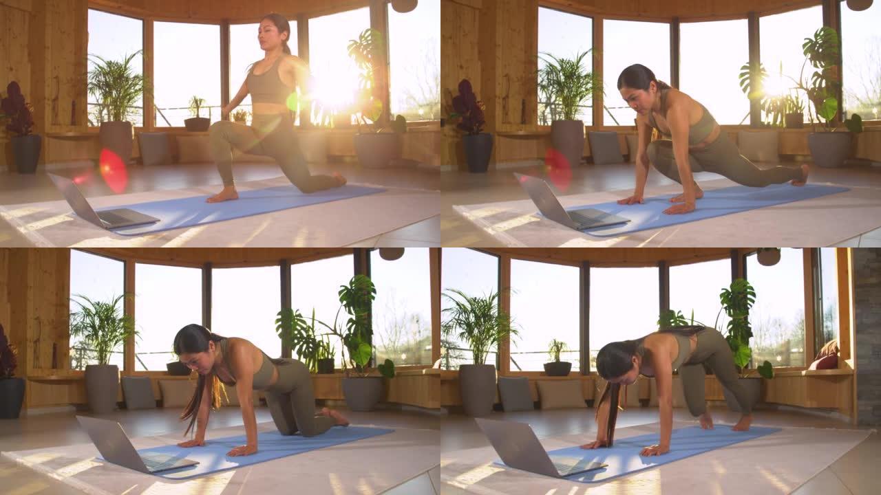 慢动作: 美丽的亚洲女人在家在线上初级瑜伽课